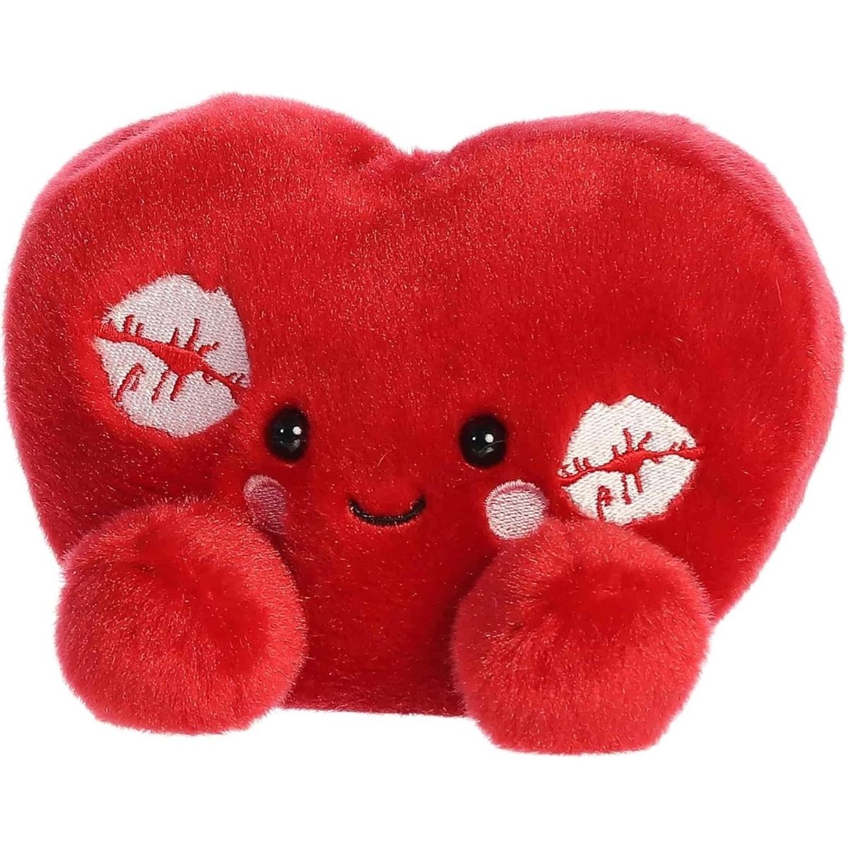Angled front view of the smiling Kimi Kisses plush heart sitting happily on its little plush bottom.