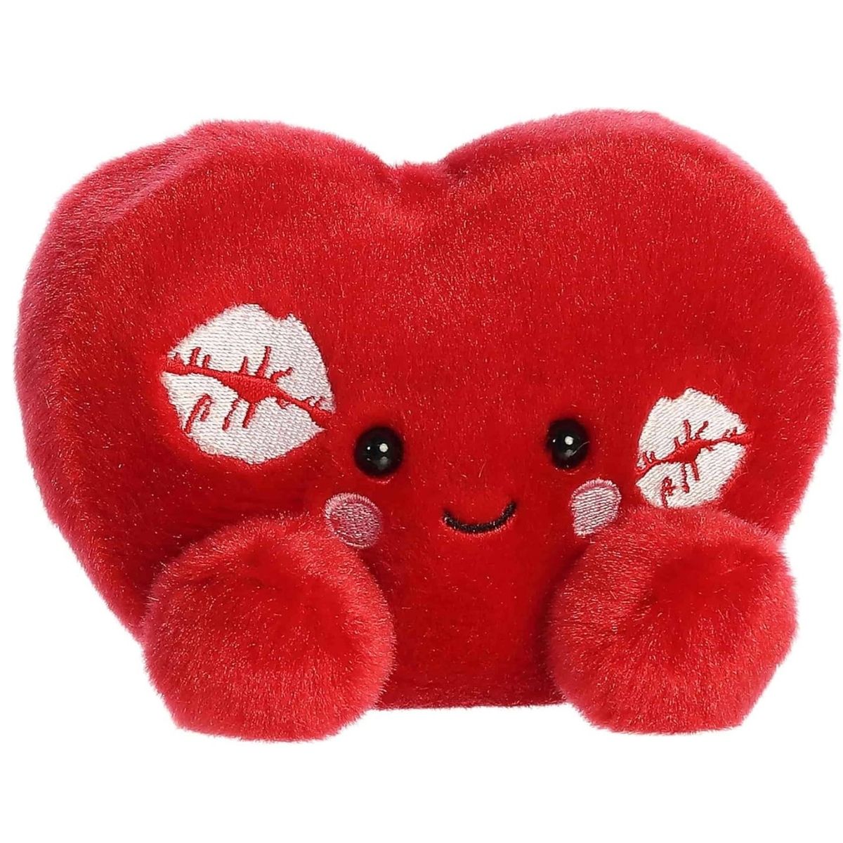 Straight front view of the sitting red plush heart showing its sweet smiling face, rosy cheeks, and white embroidered kisses.