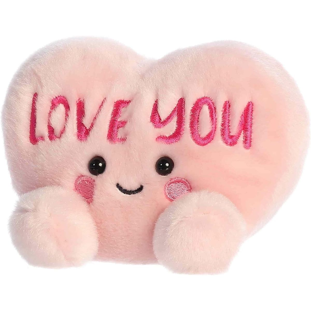 Angled front view of the smiling LOVE YOU plush heart sitting happily on its little plush bottom.