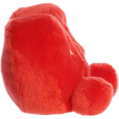 Side profile view of the Palm Pals XOXO Candy Heart plush highlighting its plump, rounded shape and little plush feet.