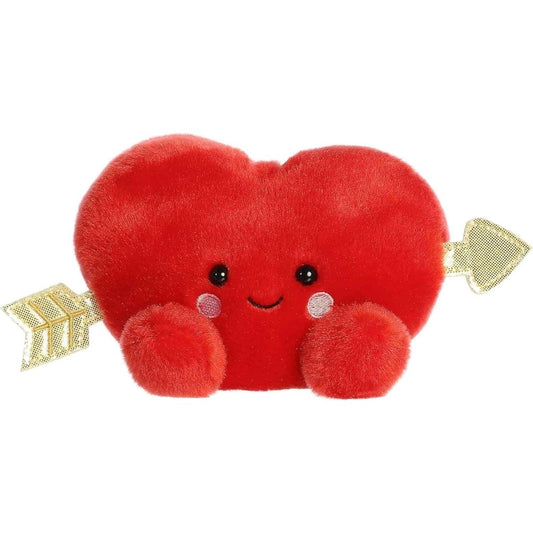 Straight front view of the sitting red plush heart showing its sweet smiling face, rosy cheeks, and the gold arrow passing through.