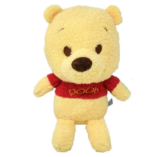 Front view of the Disney Baby Cuteeze 12-inch Winnie the Pooh plush standing upright, featuring soft textured yellow fabric and his classic red shirt.
