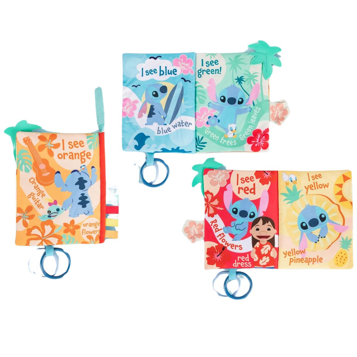 An open product layout view of the Stitch cloth book pages showing bright orange, blue, and yellow tropical character spreads.