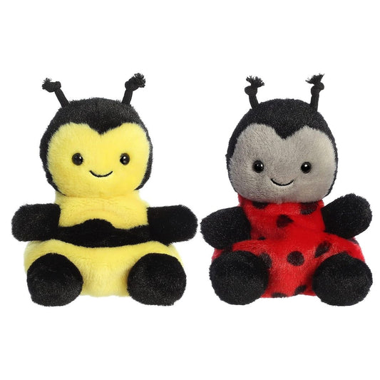 Close-up front view of the smiling yellow Palm Pals Queeny Bee and red Lil Spots Ladybug plush toys.
