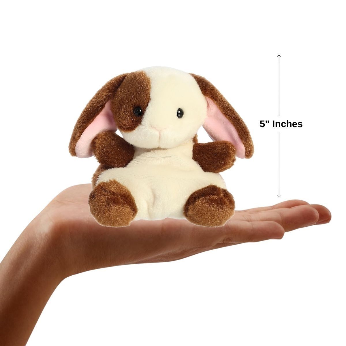 Sizing graphic for the Aurora Palm Pals Clover Bunny plush showing it sitting perfectly in the palm of a hand, indicating a total height of 5 inches.