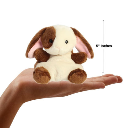 Sizing graphic for the Aurora Palm Pals Clover Bunny plush showing it sitting perfectly in the palm of a hand, indicating a total height of 5 inches.