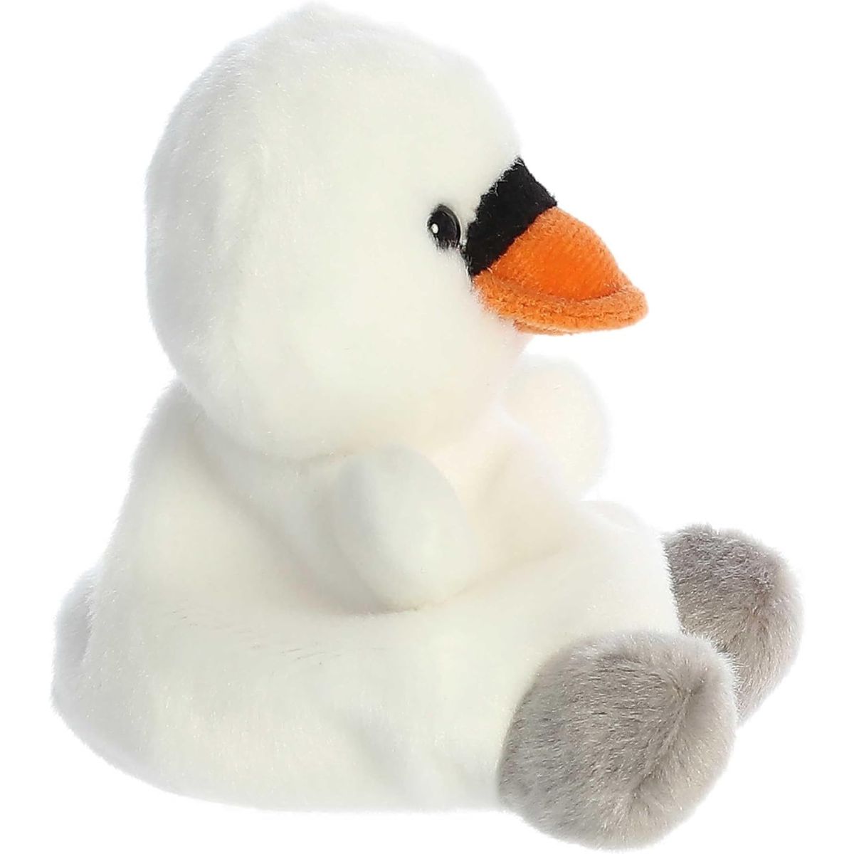 Right side profile view of the swan plush showing its rounded head, small white wing nub, and seated posture.