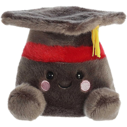 Straight-on front view of the graduation cap stuffed animal highlighting its sweet stitched smile, embroidered pink cheeks, and small grey nubby hands.