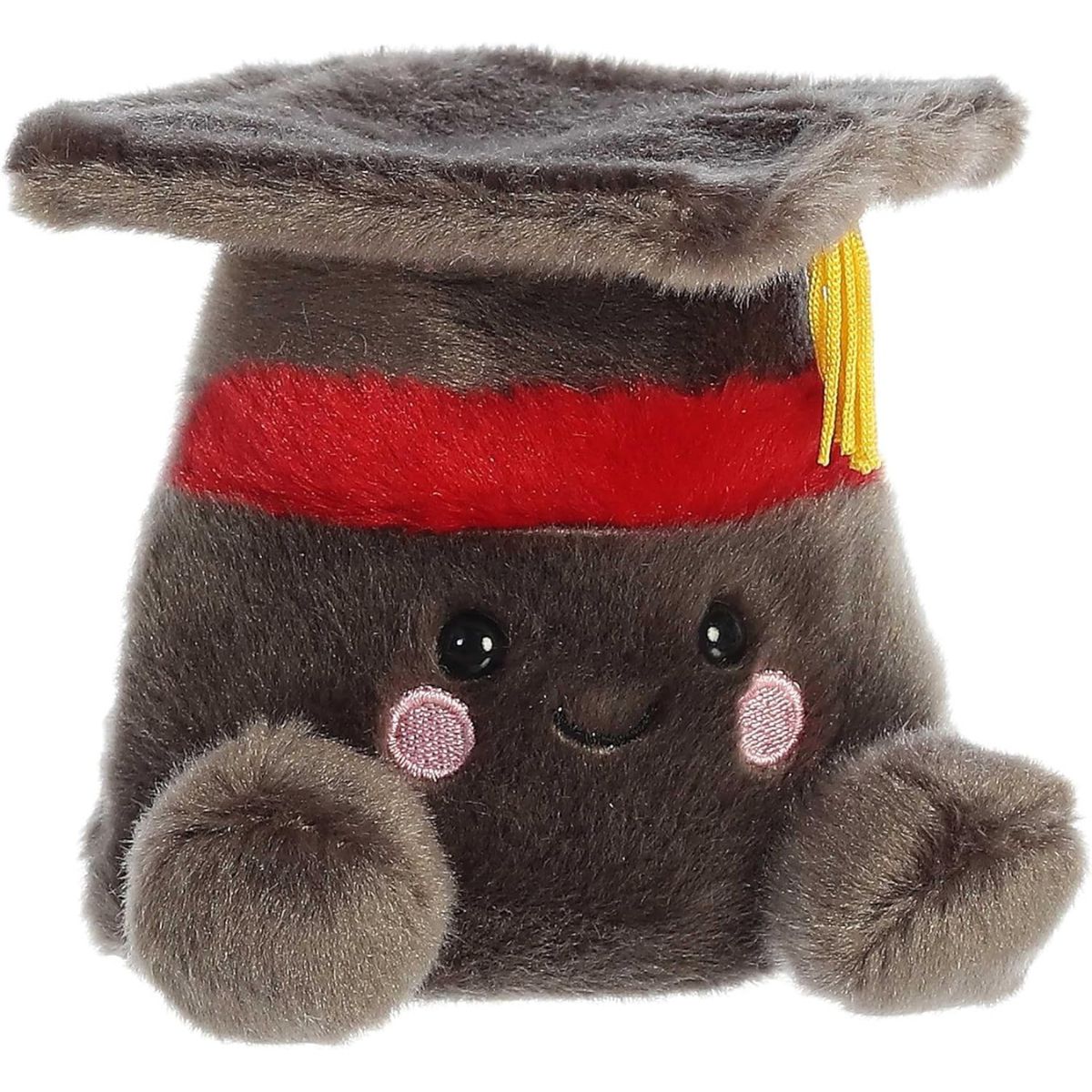 Three-quarter view of the Aurora Palm Pals Scholarly Graduation Cap 5-inch plush sitting upright, featuring charcoal-grey fur, a red band, and a yellow tassel.