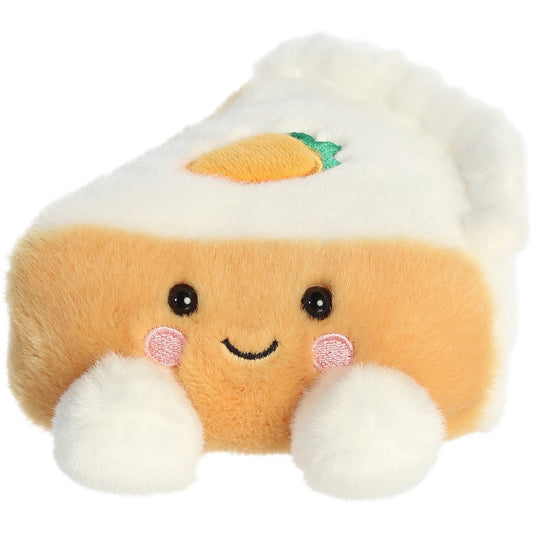 Aurora 5-inch Palm Pals Carrie Carrot Cake plush toy showing its triangular cake slice shape, light orange body, white frosting layers, tiny embroidered carrot on top, and smiling face.