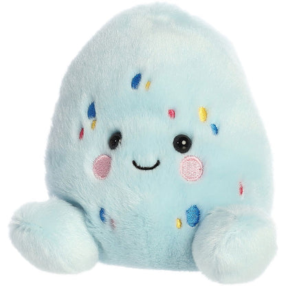 Another angled front view thumbnail of the smiling light blue egg plush showing its colorful speckled details.