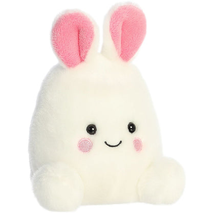 Aurora 5-inch Palm Pals Bouncy Bunny Egg plush toy sitting at an angle showing its white egg-shaped body, bright pink inner ears, and smiling face.