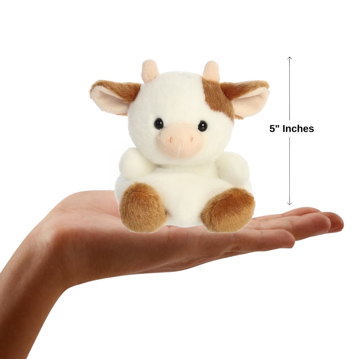 Sizing graphic for the Aurora Palm Pals Caroline Brown Cow plush showing it sitting perfectly in the palm of a hand, indicating a total height of 5 inches.