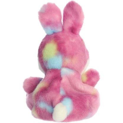 Back view of the Aurora bunny plush showcasing its colorful berry-pink tie-dye coat and tiny white plush tail.