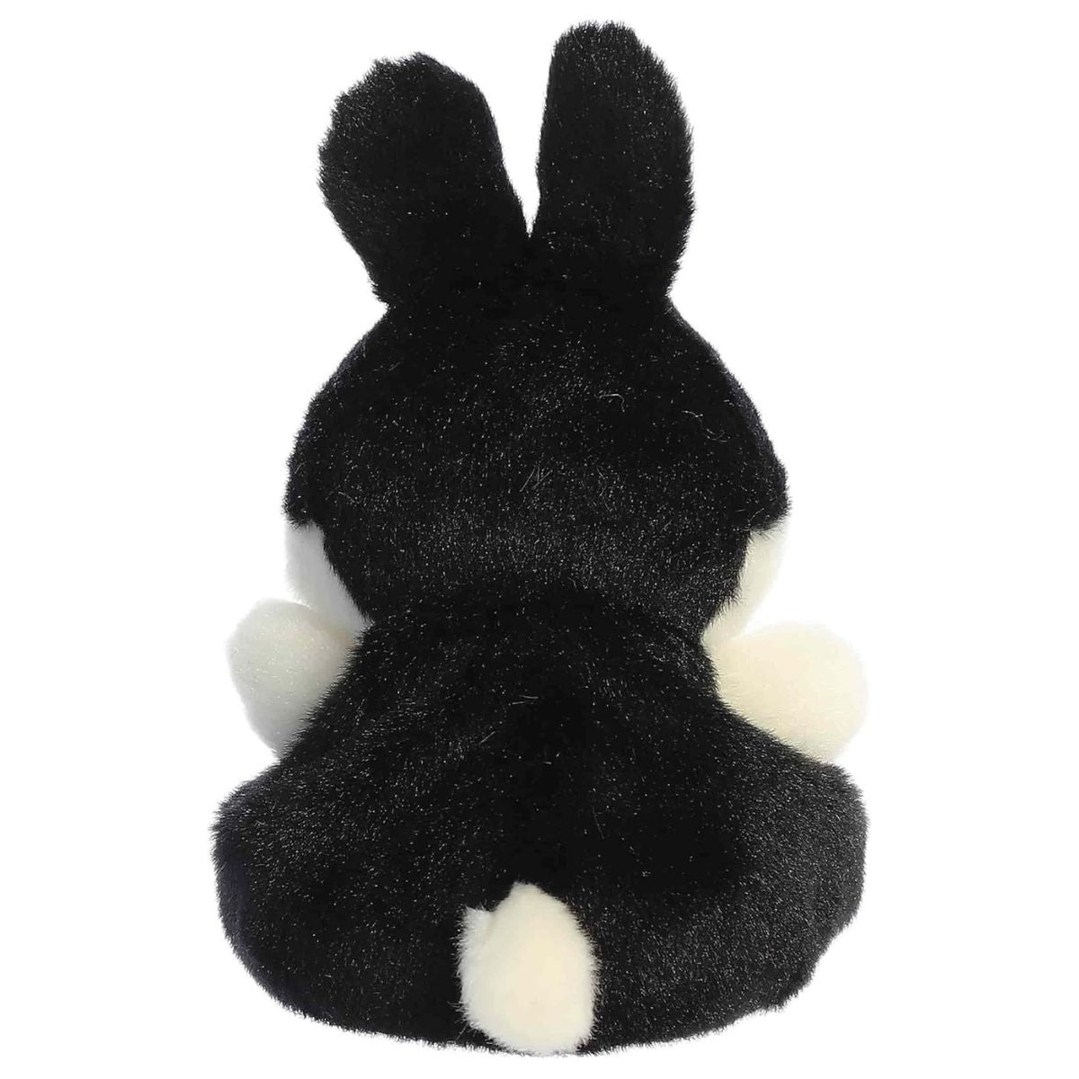Direct back view of the cuddly black Palm Pals bunny stuffed animal showing its fluffy white tail.