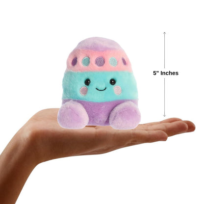 Dimension graphic showing the 5-inch Aurora Palm Pals Cotton Easter Egg resting comfortably in a person's hand.