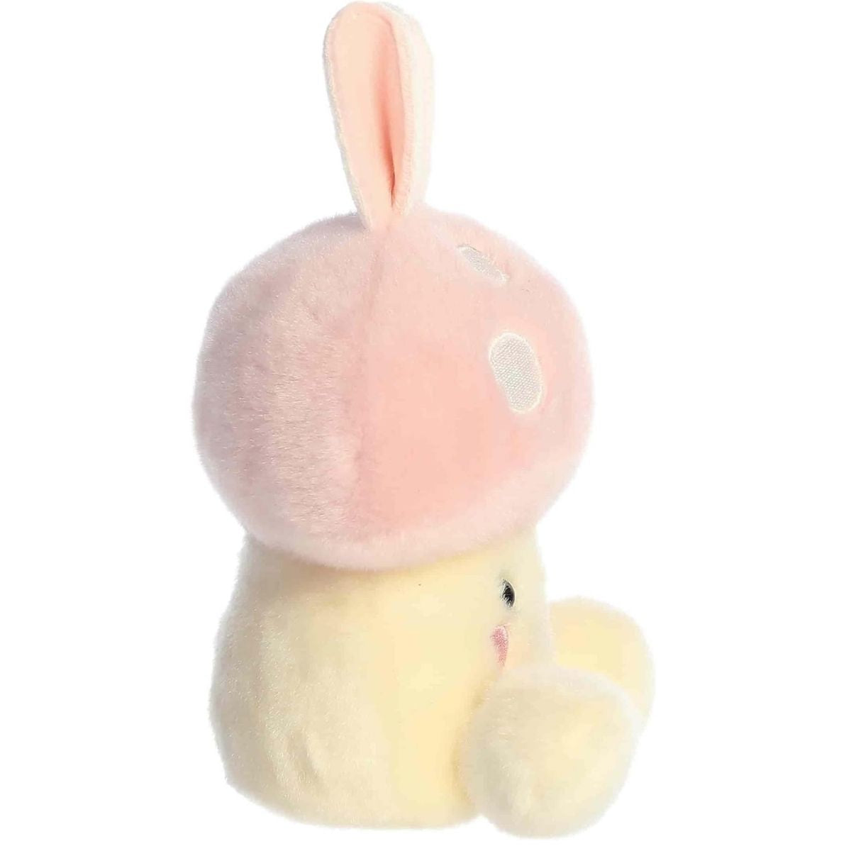 Side profile view of the Palm Pals Diana Bunny Mushroom highlighting the fluffy texture of the pink mushroom cap and its rounded shape.