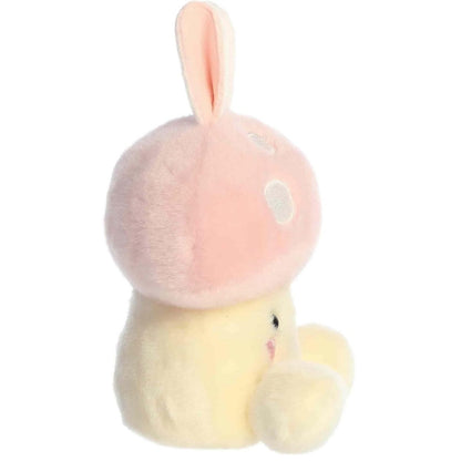 Side profile view of the Palm Pals Diana Bunny Mushroom highlighting the fluffy texture of the pink mushroom cap and its rounded shape.