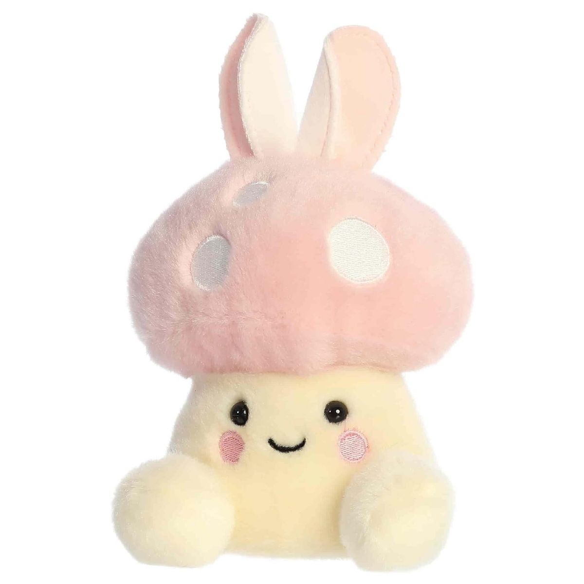 Angled front view of the smiling bunny mushroom plush sitting happily on its little plush feet.