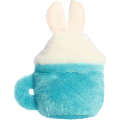 Back view of the Aurora Palm Pals latte plush toy showing its solid soft blue back, handle on the left side, and the back of its bunny ears.