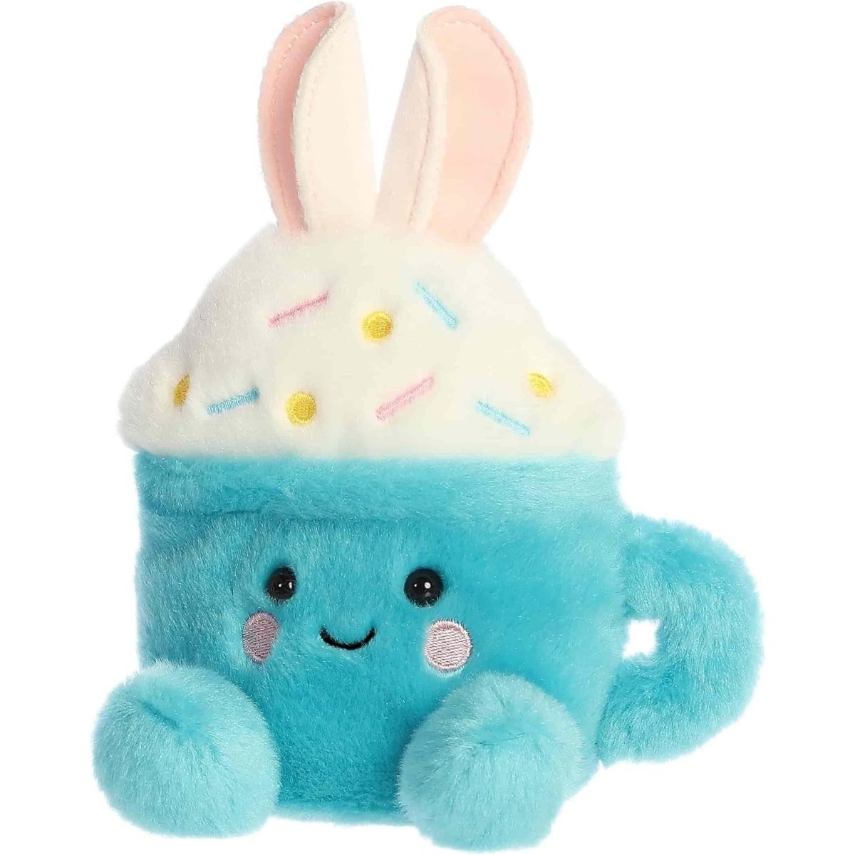 Angled view of the sweet Palm Pals Lopi Bunny Latte plush looking slightly to the left, showing its right blue foot.
