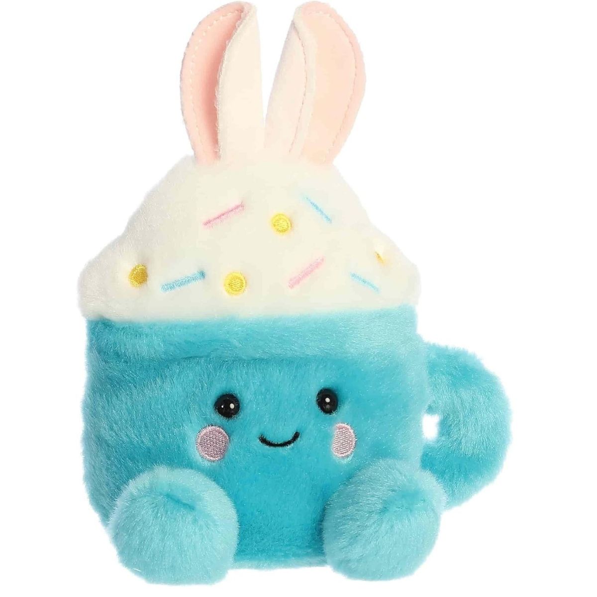 Angled front view of the adorable Aurora Lopi Bunny Latte stuffed animal featuring a sweet smile, rosy pink cheeks, dark eyes, and a blue mug handle.