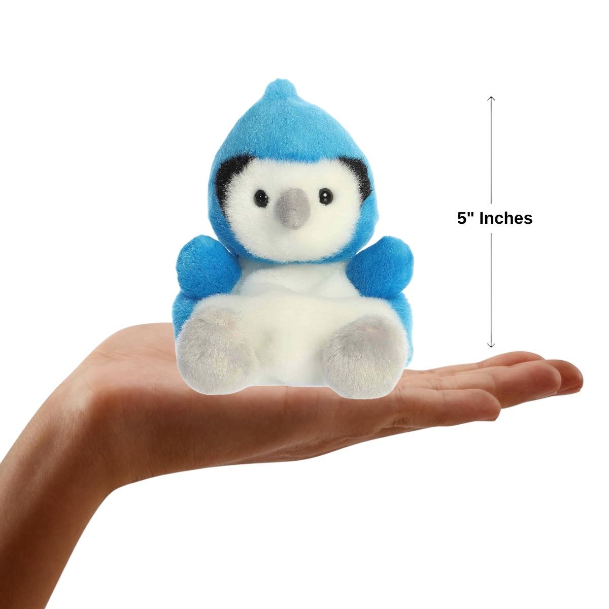 Sizing graphic for the Aurora Palm Pals Chatters Blue Jay plush showing it sitting perfectly in the palm of a hand, indicating a total height of 5 inches.