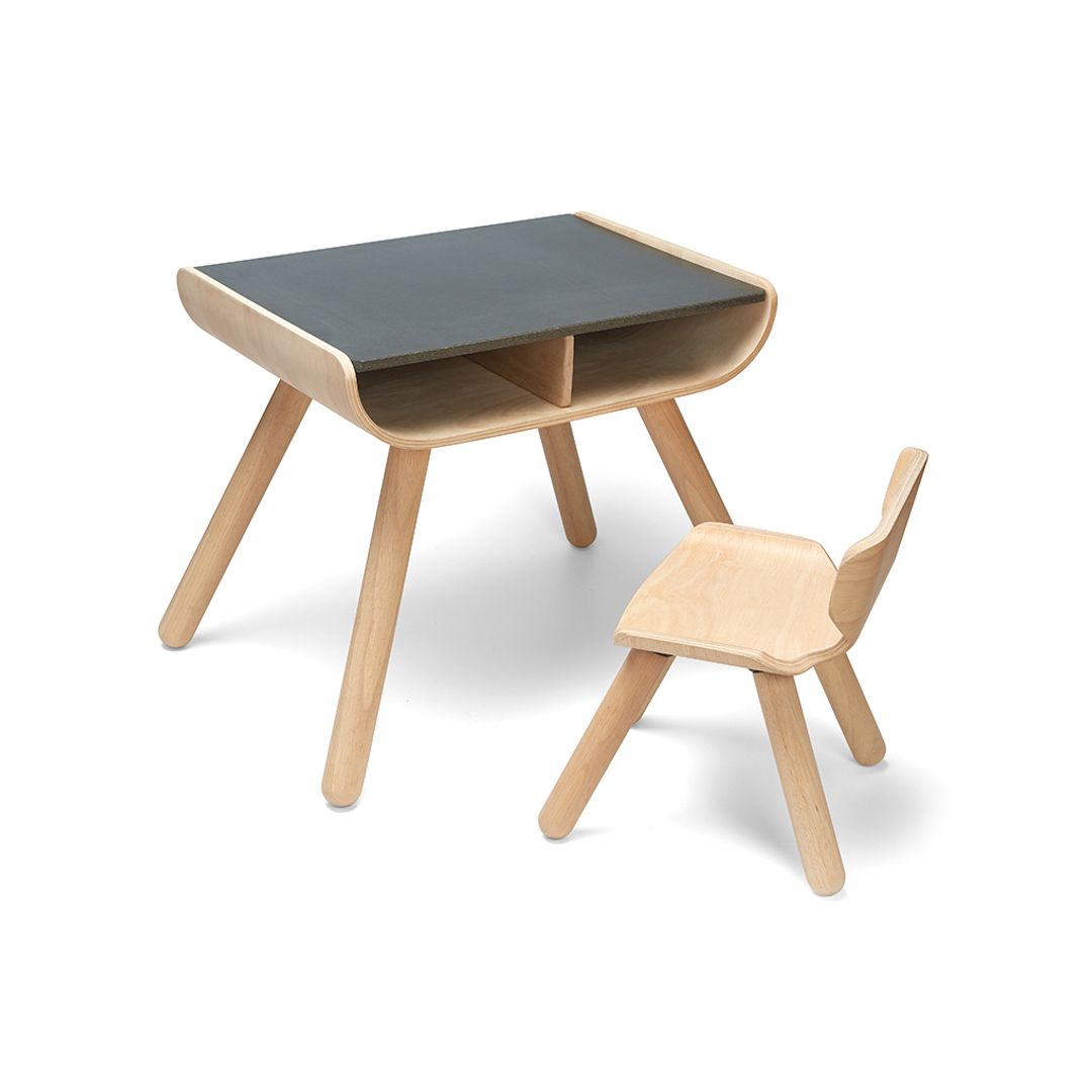 Angled profile of the chemical-free rubberwood PlanToys kids furniture set highlighting the matching curved wooden chair.
