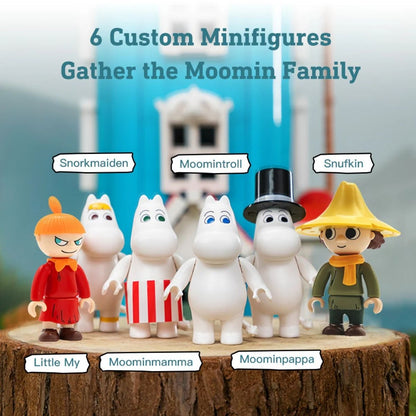 Close-up of the 6 custom Moomin minifigures included in the set: Little My, Moominmamma, Moomintroll, Moominpappa, Snorkmaiden, and Snufkin standing on a log.
