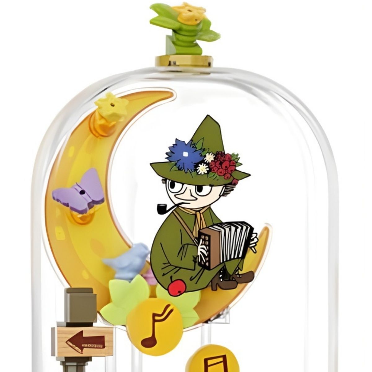 Close-up of the brick-built Snufkin figure sitting on a yellow moon and playing an instrument in the Pantasy Moomin set.