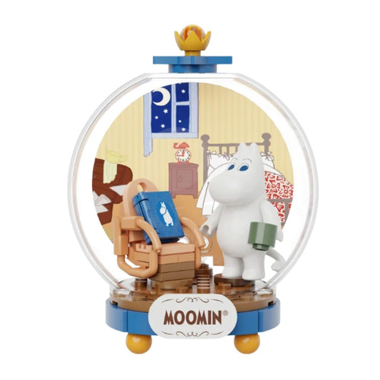 Completed Pantasy Moomin Leisurely Time building block set featuring Moomintroll in a cozy bedroom inside a clear display dome.
