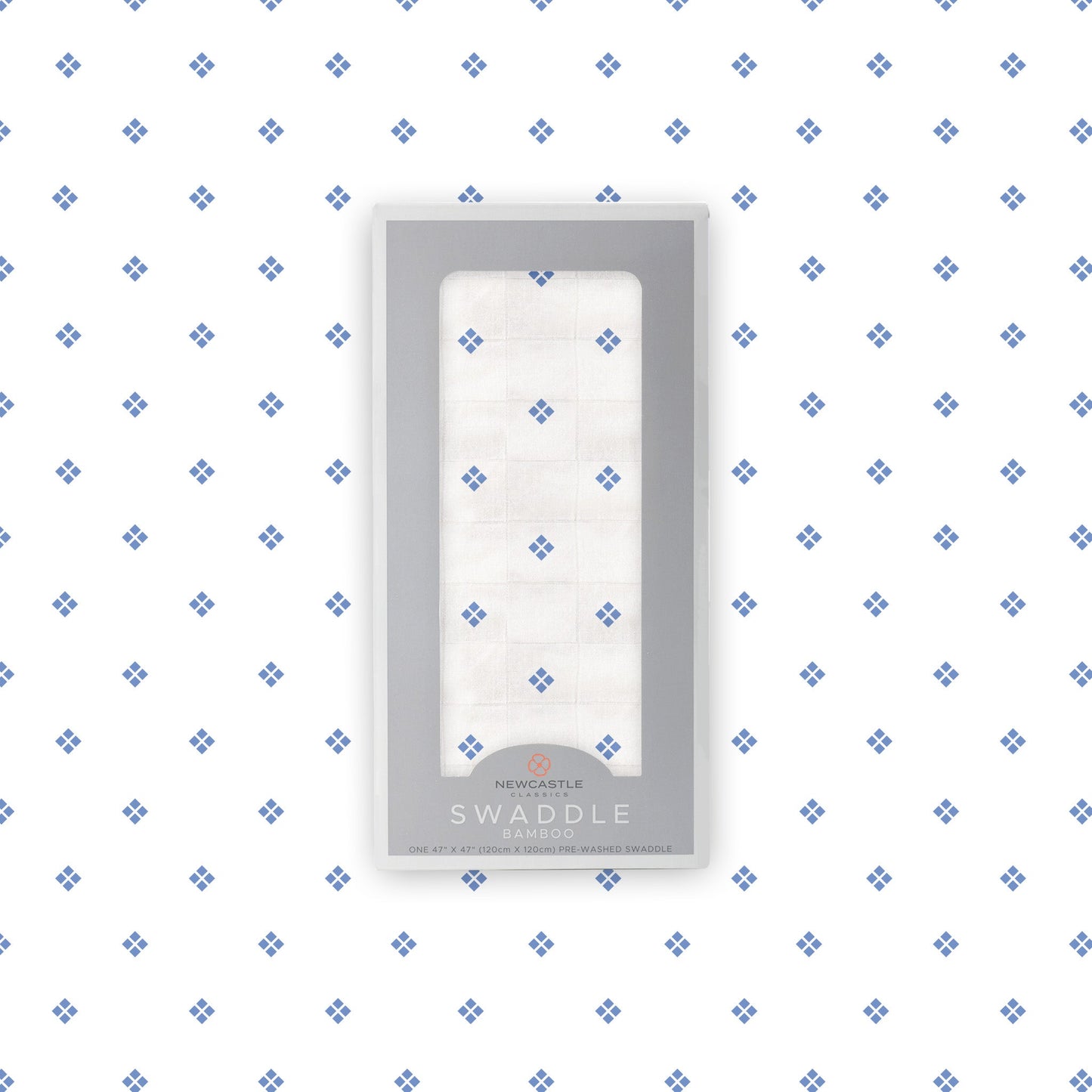 Flat lay of the Newcastle Classics Periwinkle Diamond Polka Dot bamboo muslin swaddle blanket shown with its branded packaging box in the center.