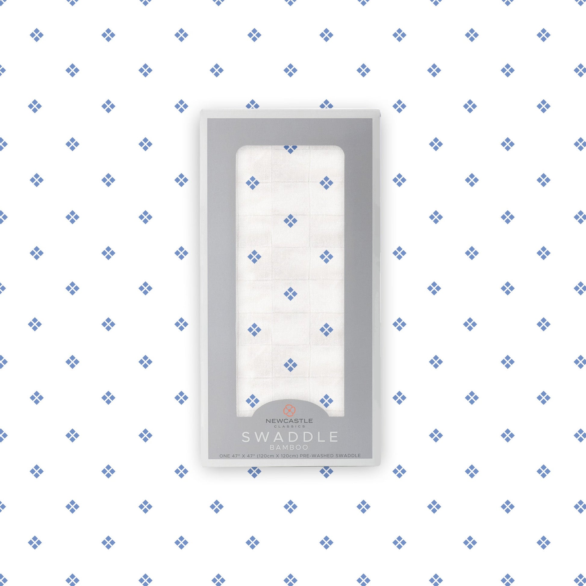 Flat lay of the Newcastle Classics Periwinkle Diamond Polka Dot bamboo muslin swaddle blanket shown with its branded packaging box in the center.