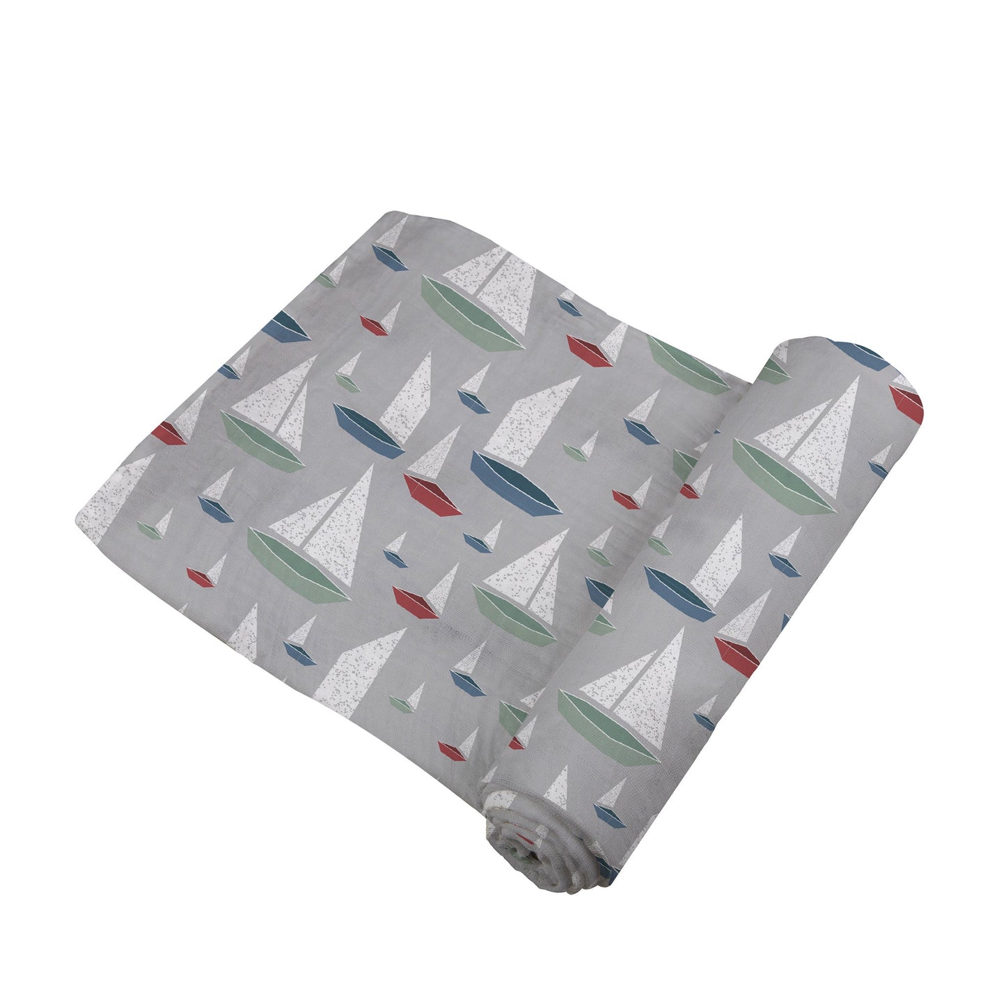 Angled view of the grey swaddle blanket with colorful sailboats partially unrolled to show its soft texture.