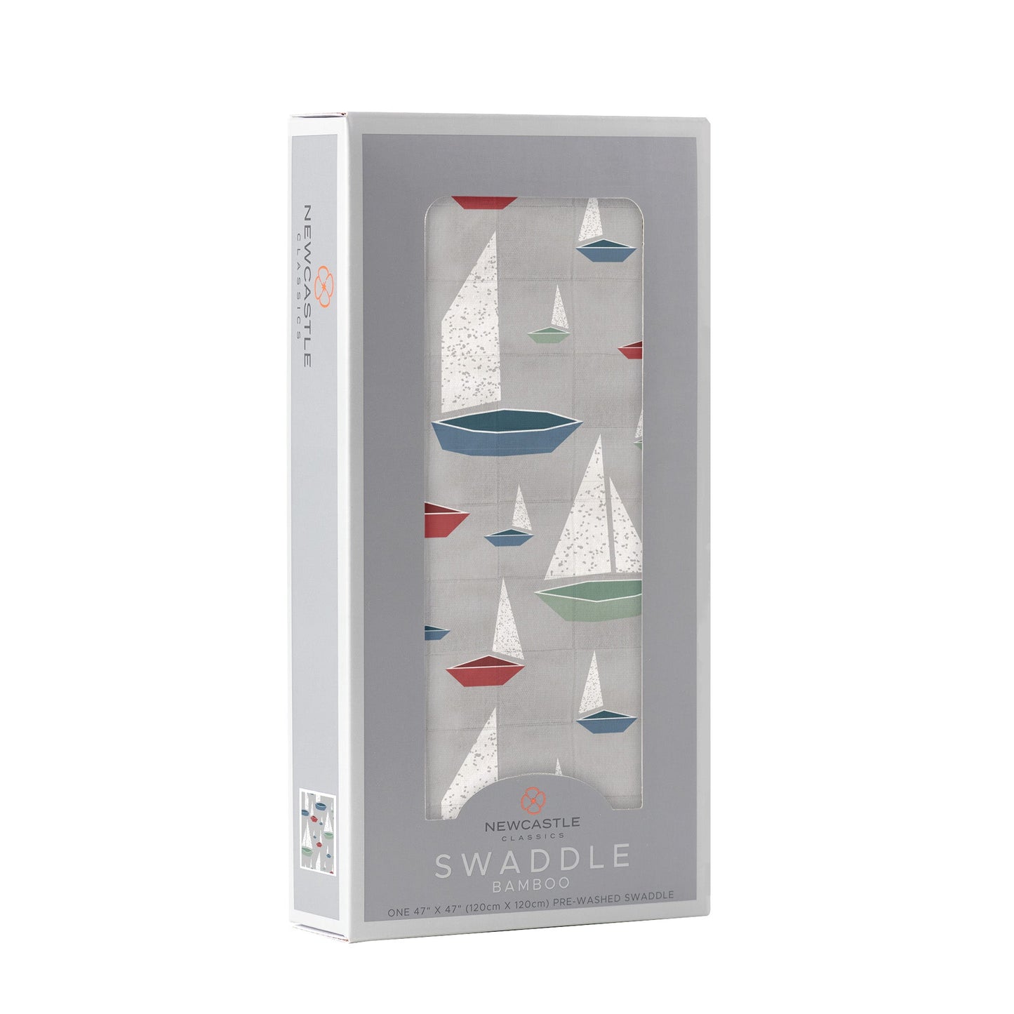 Angled front view of the packaged Marina Sailboats baby swaddle blanket folded inside a light grey Newcastle Classics window display box.