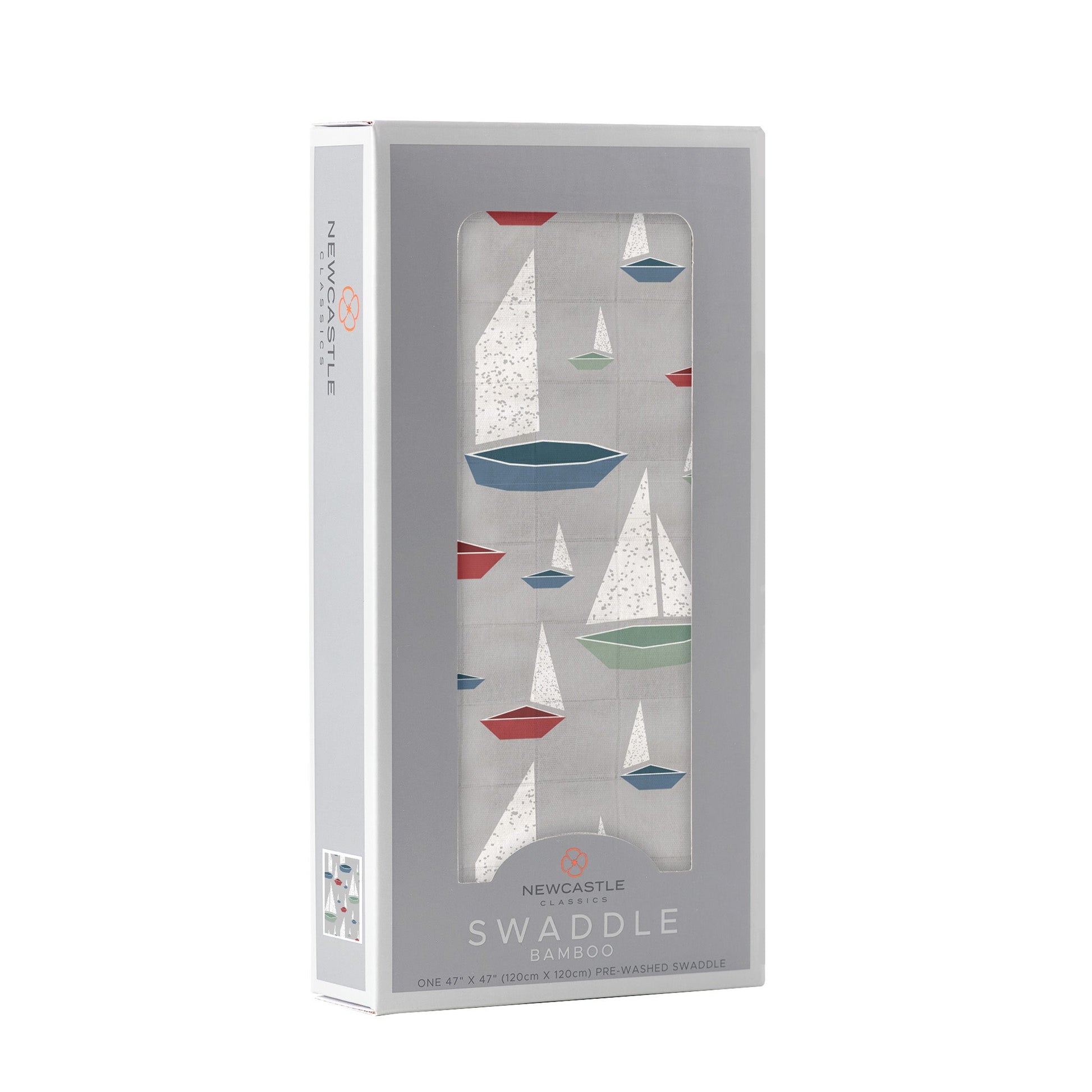 Angled front view of the packaged Marina Sailboats baby swaddle blanket folded inside a light grey Newcastle Classics window display box.