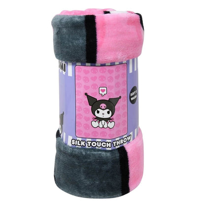 Close-up view of the rolled-up Kuromi silk touch throw blanket showing its soft black and pink texture and the printed packaging band.