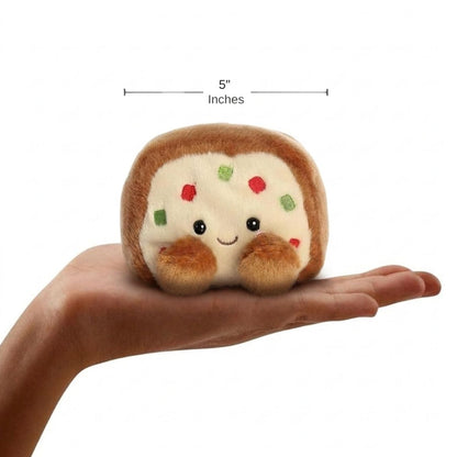 The miniature Fran Fruit Cake plush sitting balanced in an open human hand under a 5-inch height graphic indicator.