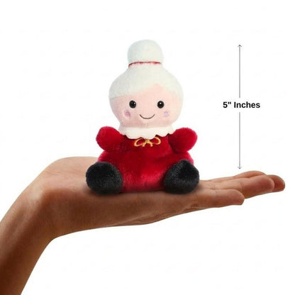 The miniature Mrs. Claus plush sitting balanced in an open human hand under a 5-inch height graphic indicator.