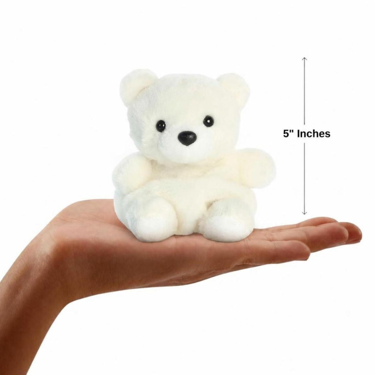 Dimension graphic showing the 5-inch Aurora Palm Pals Puck Polar Bear resting comfortably in a person's hand.