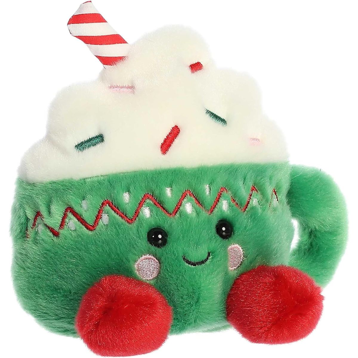 Aurora 5-inch Palm Pals Candace Hot Cocoa plush toy shaped like a green mug with a red and white zig-zag rim, white whipped cream topping, sprinkles, and a candy cane straw.