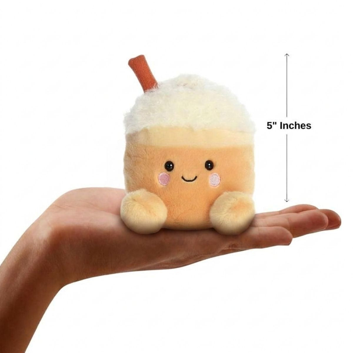 The miniature Speckle Pumpkin Spice Latte plush sitting balanced in an open human hand under a 5-inch height graphic indicator.