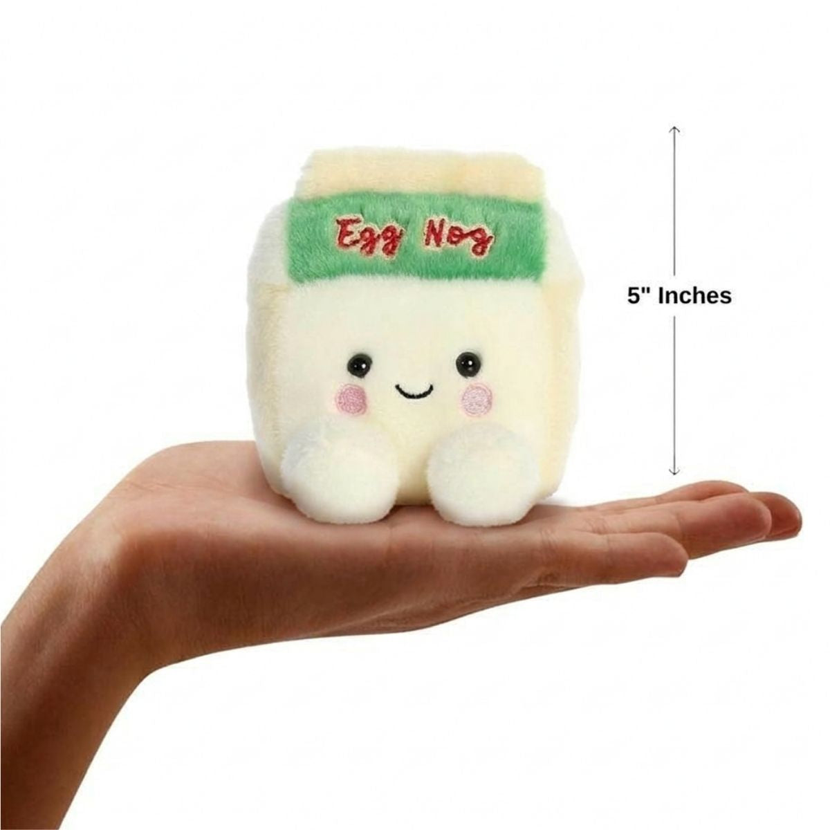 The miniature Emery Eggnog plush carton sitting balanced in an open human hand under a 5-inch height graphic indicator.