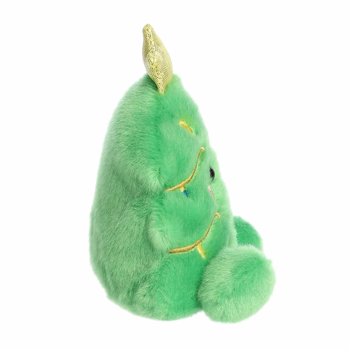 Green plush toy with gold accents on a white background