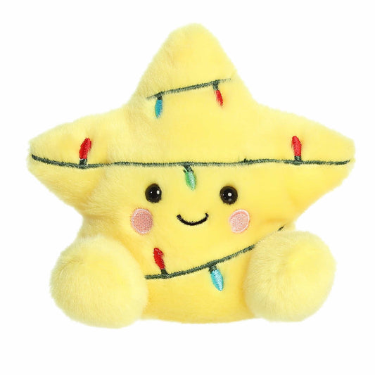 Yellow plush star toy with Christmas lights and a smiling face on a white background