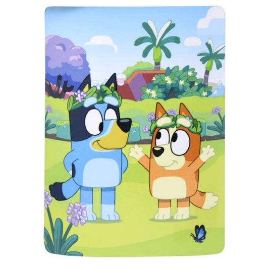 Main front view of the fully unrolled Bluey and Bingo silky fleece throw blanket featuring the Heeler sisters wearing flower crowns in a sunny backyard setting.