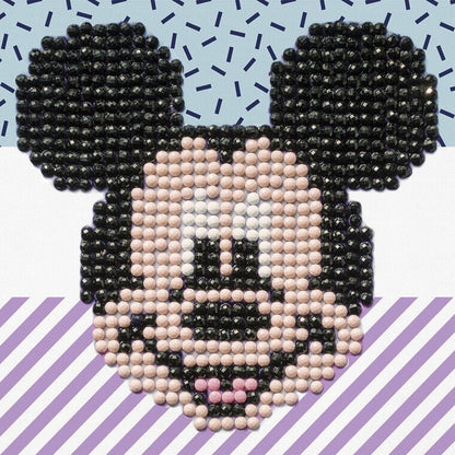 Finished Diamond Dotz Disney Mickey Mouse Fun diamond painting featuring Mickey's smiling face on a blue and purple patterned background.