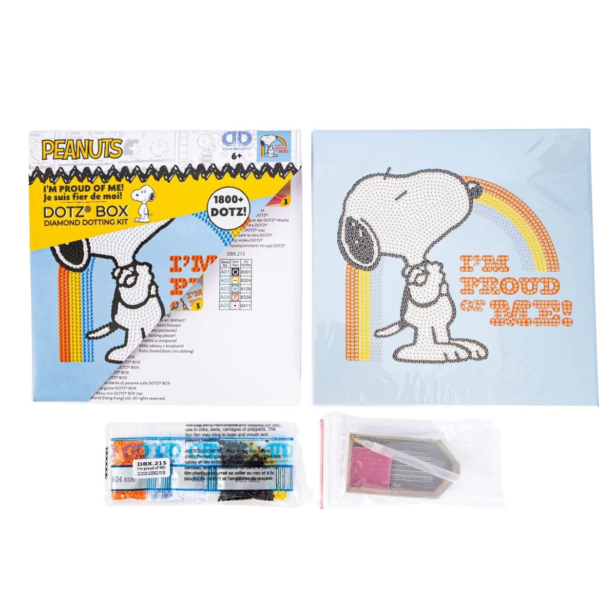 Contents of the Diamond Dotz Box kit, including the Peanuts Snoopy canvas box, colorful diamond drills, stylus tool, wax, and craft tray.