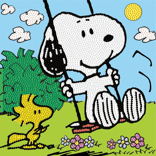 Finished DIAMOND DOTZ Peanuts diamond painting featuring Snoopy playing on a swing while Woodstock watches in a sunny park.