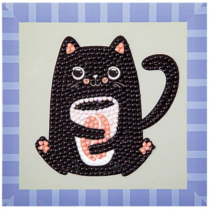 Finished DIAMOND DOTZ Coffee Bean Kitten diamond painting featuring a black cat holding a coffee mug with a blue and white striped border.